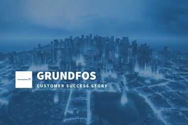GRUNDFOS customer success story featuring an aerial view of a modern city skyline